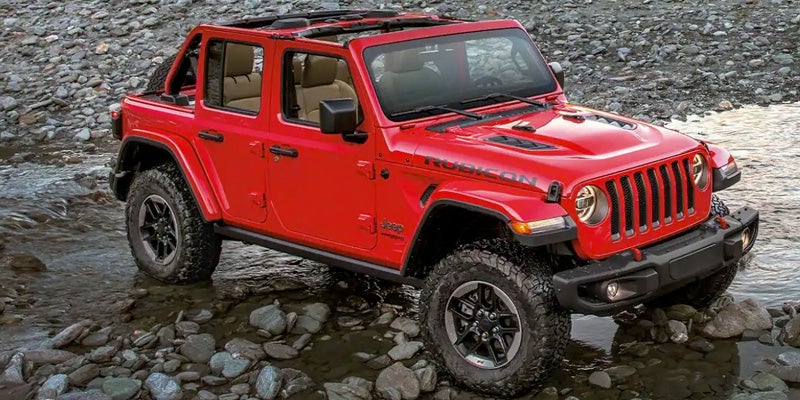 A 2022 Jeep Wrangler Driving on Rocks
