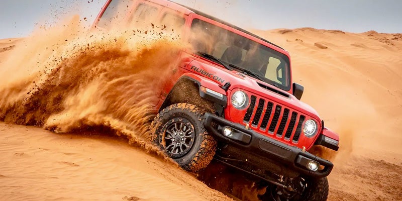 A 2022 Jeep Wrangler Driving in the desert